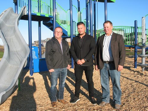 Canstar Community News Oct. 18, 2018 - (From left) RM of Macdonald councillor Robert Turski, Ventura Land Development president Tim Comack and Macdonald reeve Brad Erb stand in the newly installed playground within Ventura's Prairie View Lakes development in La Salle. (ANDREA GEARY?CANSTAR COMMUNITY NEWS)