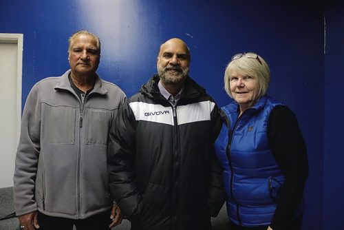 Canstar Community News Oct. 24, 2018 - Kaur Sidhu (middle), who was running for Old Kildonan ward, with his friends and volunteers Paul Sandhu (left) and Luba Fedorkiw (right) at his headquarters on Oct. 24. (LIGIA BRAIDOTTI/CANSTAR NEWS/TIMES)
