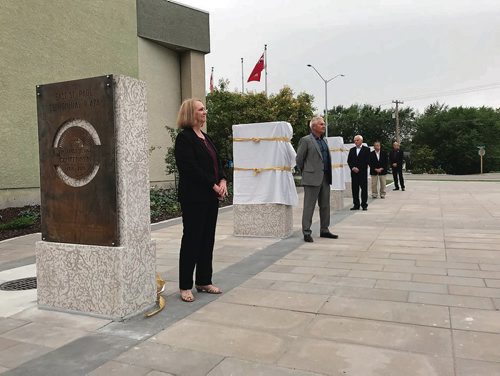 Canstar Community News (From left) East St. Paul mayor Shelley Hart and Couns. Orest Horechko, Brian Duval, Michael Wasylin, and Charles Posthumus unveiled historic markers at the East St. Paul Centennial Plaza grand opening on Aug. 16.  (SHELDON BIRNIE/CANSTAR/THE HERALD)