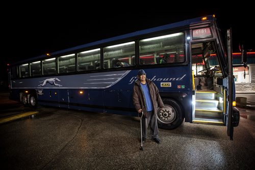 PHIL HOSSACK / WINNIPEG FREE PRESS - Headed back to The Pas, Wesley Flett steps out for a smoke with other passengers on #6181 during a 10 minute 'stretch break in Gladstone Manitoba en-route to Flin Flon. See Melissa's story. October 29, 2018