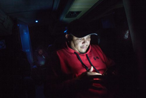 PHIL HOSSACK / WINNIPEG FREE PRESS - Darrell Forbister plays games on his phone deep into the night on Greyhound bus #6181 en-route to Flin Flon. See Melissa's story. October 29, 2018