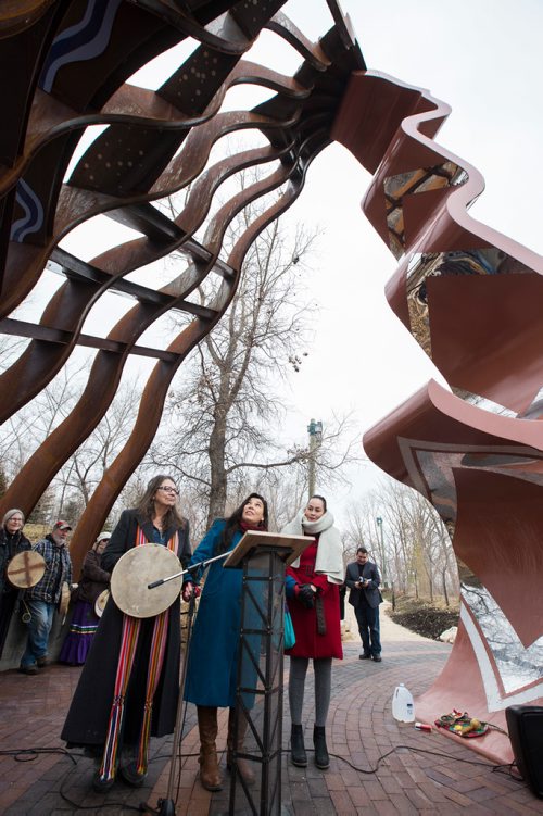 MIKE DEAL / WINNIPEG FREE PRESS
The official unveiling of the sculpture, Niimaamaa, meaning "Mother," at the south point entrance to The Forks at Main Street. The three indigenous artists who conceived the work, Val Vint (left), KC Adams (centre) and Jaimie Isaac (right), were on hand to dedicate the 30-foot tall metal sculpture of a kneeling pregnant woman. 
181101 - Thursday, November 01, 2018.