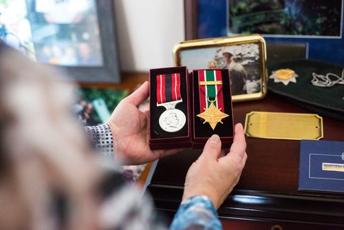 MIKAELA MACKENZIE / WINNIPEG FREE PRESS
Anita Cenerini, who fought for her son to receive full military honours after his suicide and is the 2018 National Silver Cross Mother, picks up her son's medals in her home in Winnipeg on Thursday, Nov. 1, 2018. 
Winnipeg Free Press 2018.