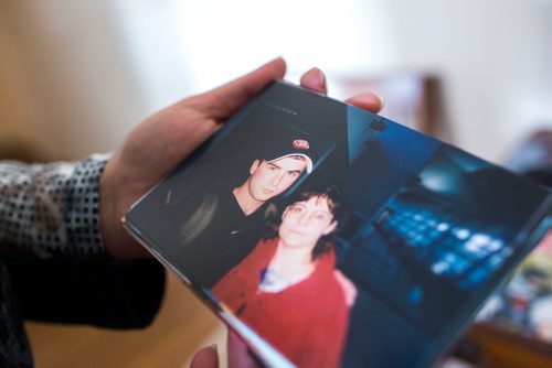 MIKAELA MACKENZIE / WINNIPEG FREE PRESS
Anita Cenerini, who fought for her son to receive full military honours after his suicide and is the 2018 National Silver Cross Mother, looks through photos of her son in her home in Winnipeg on Thursday, Nov. 1, 2018. 
Winnipeg Free Press 2018.