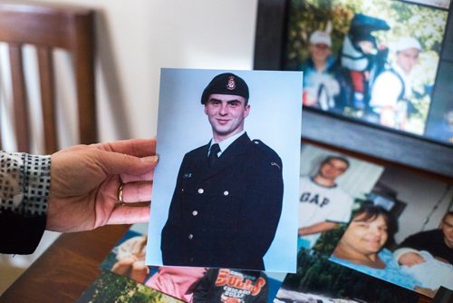 MIKAELA MACKENZIE / WINNIPEG FREE PRESS
Anita Cenerini, who fought for her son to receive full military honours after his suicide and is the 2018 National Silver Cross Mother, looks through photos of her son in her home in Winnipeg on Thursday, Nov. 1, 2018. 
Winnipeg Free Press 2018.