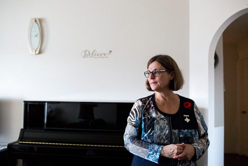 MIKAELA MACKENZIE / WINNIPEG FREE PRESS
Anita Cenerini, who fought for her son to receive full military honours after his suicide and is the 2018 National Silver Cross Mother, poses for a portrait in her home in Winnipeg on Thursday, Nov. 1, 2018. 
Winnipeg Free Press 2018.