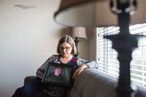 MIKAELA MACKENZIE / WINNIPEG FREE PRESS
Anita Cenerini, who fought for her son to receive full military honours after his suicide and is the 2018 National Silver Cross Mother, poses for a portrait in her home in Winnipeg on Thursday, Nov. 1, 2018. 
Winnipeg Free Press 2018.