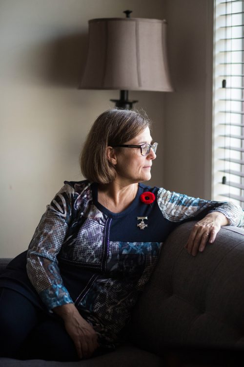 MIKAELA MACKENZIE / WINNIPEG FREE PRESS
Anita Cenerini, who fought for her son to receive full military honours after his suicide and is the 2018 National Silver Cross Mother, poses for a portrait in her home in Winnipeg on Thursday, Nov. 1, 2018. 
Winnipeg Free Press 2018.