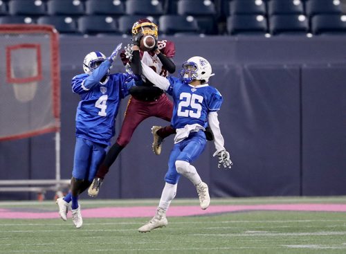 TREVOR HAGAN / WINNIPEG FREE PRESS
River East Kodiaks' Victor Mubambe (4) and Joseph Funk-Clements (25) try to break up a pass to Portage Collegiate Trojans' Colby Irwin (84) during their division 2 semi final game at Investors Group Field, Thursday, November 1, 2018.