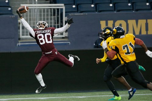 JOHN WOODS / WINNIPEG FREE PRESS
St Paul's Crusaders' Muludesta Yitna (80) goes up for the pass against the Dakota Lancers in the Winnipeg High School semi finals  Friday, November 2, 2018.