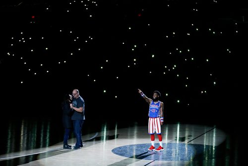 JOHN WOODS / WINNIPEG FREE PRESS
Trina and Norbert Viallet, who have been married fourteen years, dance at centre court as Ant of the Harlem Globetrotters looks on during their show in Winnipeg Sunday, November 4, 2018.