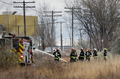 PHIL HOSSACK / WINNIPEG FREE PRESS - Firefighters move hose and begin fighting a fire at an oil seed crushing plant on (Google Earth lists the building as Friendly Family Farms) Dawson Road Monday afternoon. - November 05, 2018