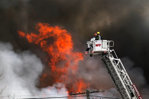 PHIL HOSSACK / WINNIPEG FREE PRESS - Firefighters raise an aerial ladder truck into position fighting a fire at an oil seed crushing plant on (Google Earth lists the building as Friendly Family Farms) Dawson Road Monday afternoon. - November 05, 2018