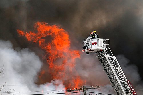 PHIL HOSSACK / WINNIPEG FREE PRESS - Firefighters raise an aerial ladder truck into position fighting a fire at an oil seed crushing plant on (Google Earth lists the building as Friendly Family Farms) Dawson Road Monday afternoon. - November 05, 2018