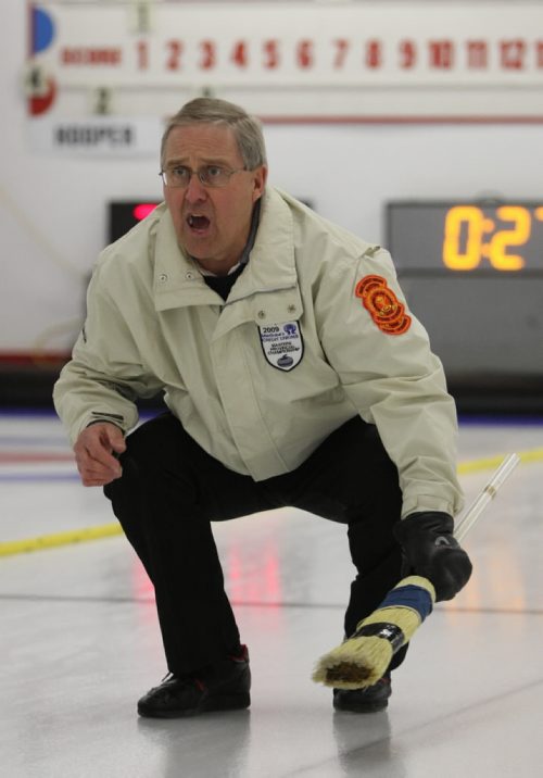Brandon Sun 13032009 Skip Doug Armour barks orders to his teammates during his rink's match against Barry Sadler's rink during the Manitoba Master's Men's Curling Championships at the Minnedosa Curling Club on Friday afternoon. (Tim Smith/Brandon Sun)