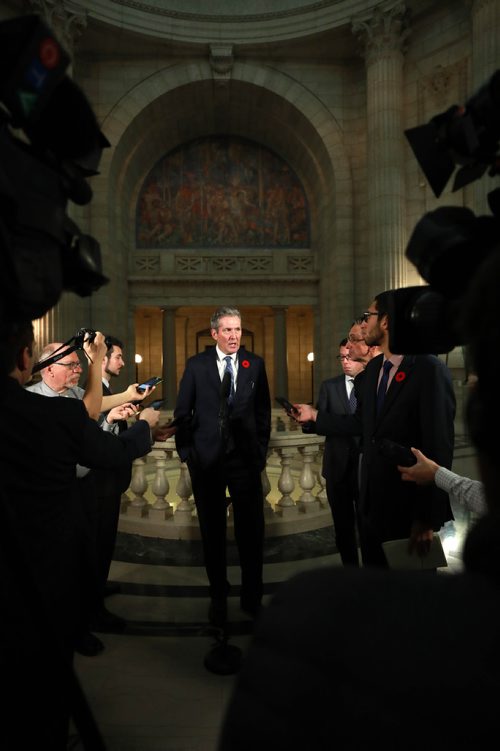 RUTH BONNEVILLE / WINNIPEG FREE PRESS

Premier Brian Pallister answers questions from the media regarding the carbon tax issue with Trudeau's  feds  after question period in the house, in the rotunda at the  Legislative Building Tuesday.


Nov 6th , 2018