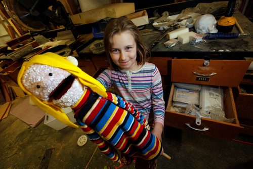 PHIL HOSSACK / WINNIPEG FREE PRESS -Laine Wilding 8,poses with a puppet replicating her at the family's "WoodenSquirrel Workshop" Tuesday night in their St Francios Xavier home. See Sanderson's story.  - November 6, 2018
