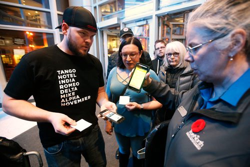 JOHN WOODS / WINNIPEG FREE PRESS
Jake and Erin Doty's digital tickets are scanned before the Jack White concert at the BellMTS Place Tuesday, November 6, 2018.