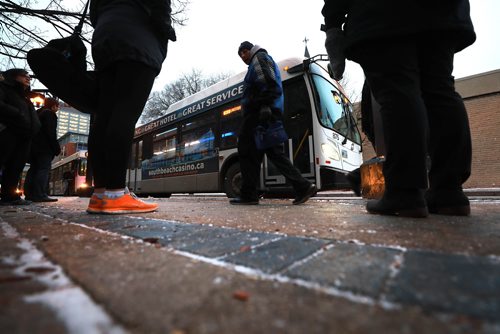 RUTH BONNEVILLE / WINNIPEG FREE PRESS

People wait to catch their bus on Graham Ave. in from of WPS Wednesday.  Moody, nondescript photo for story on bus safety.  

Nov 7th , 2018