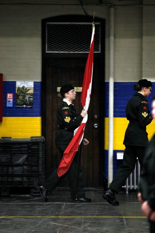 PHIL HOSSACK / WINNIPEG FREE PRESS - BORDERS - A member of the colour party hustles the flag into position as Cadets of the 1226 Fort Garry Horse Army Cadet Corps worked their parade drill Wednesday evening preparing for ceremonies and parade on Rememberance Day at McGregor Armoury. - November 7, 2018