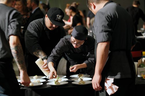 PHIL HOSSACK / WINNIPEG FREE PRESS - Workers detail plates as food is served up by Thimas Stuart of Thermea Thursday evening. Food, great food was on the menu Thursday evening at Canada's Great Kitchen Party. Patrons lined up deep to enjoy samples from some of the city's best Chef's and more.  November 8, 2018