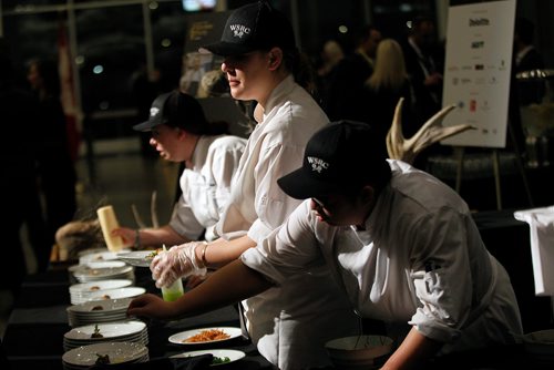 PHIL HOSSACK / WINNIPEG FREE PRESS - Staff from the Winnipeg Squash and Raquet Club detail plates Thursday at the RBC Convention Centre. Food, great food was on the menu Thursday evening at Canada's Great Kitchen Party. Patrons lined up deep to enjoy samples from some of the city's best Chef's and more.  November 8, 2018