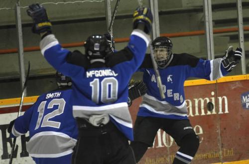 JOE BRYKSA/WINNIPEG FREE PRESS Image 6- Winkler, Manitoba-    Oak Park Raiders Kenton Gilles, right, celebrates with teammates after scoring  during first period action at the 2009 AAAA High School Hockey Championships in Winkler, Manitoba Sunday- This goal turned out to be the game winner- Mar 15, 2009