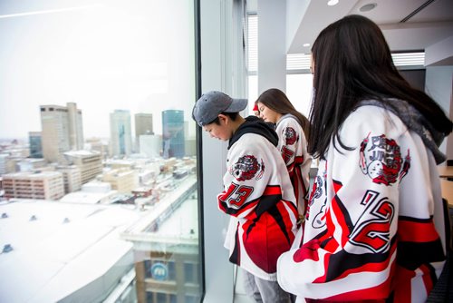 MIKAELA MACKENZIE / WINNIPEG FREE PRESS
Jessica McCorrister (centre) and other members of the Peguis Juniors (up-and-coming players not yet in the league affected) wait for a press conference to begin after a lawsuit was launched against the newly formed Capital Region Junior Hockey League at True North Square in Winnipeg on Friday, Nov. 9, 2018. 
Winnipeg Free Press 2018.