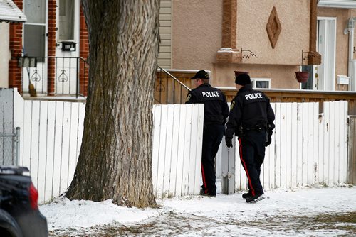 PHIL HOSSACK / WINNIPEG FREE PRESS - A pair of city police officers enter the front walkway at 335 Bannerman where a held police at bay Wednesday. - November 8, 2018