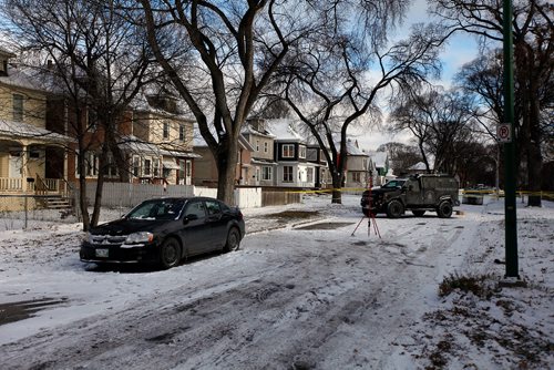 PHIL HOSSACK / WINNIPEG FREE PRESS - Police tape and the armoured vehicle block the front street at 335 Bannerman where a gunaman held police at bay Wednesday. - November 8, 2018