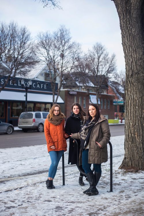 MIKAELA MACKENZIE / WINNIPEG FREE PRESS
Kelsey Wade (left), Christina Hajjar, and Amanda Murdock pose by Stella's on Sherbrook in Winnipeg on Friday, Nov. 9, 2018. The three of them are speaking out about a workplace culture of harassment at the popular Winnipeg restaurant.
Winnipeg Free Press 2018.