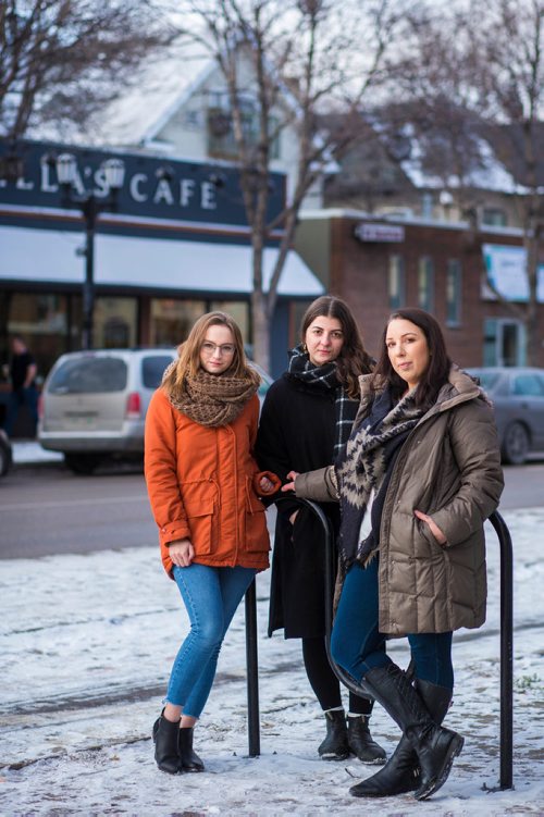 MIKAELA MACKENZIE / WINNIPEG FREE PRESS
Kelsey Wade (left), Christina Hajjar, and Amanda Murdock pose by Stella's on Sherbrook in Winnipeg on Friday, Nov. 9, 2018. The three of them are speaking out about a workplace culture of harassment at the popular Winnipeg restaurant.
Winnipeg Free Press 2018.