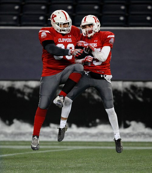 PHIL HOSSACK / WINNIPEG FREE PRESS - Kelvin CLippers #Andrew Guevara  and #15 Dason Jesmer-McFarlane leap up celebrating the 2nd of two touchdowns in the second half in a comeback attempt against River East's 13-0 lead after the first half. Mike Sawatzky's story.  - November 9, 2018
