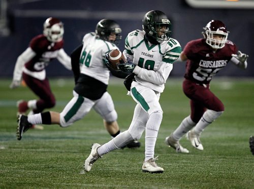 PHIL HOSSACK / WINNIPEG FREE PRESS - Vincent Mssey Trojan #10 Shad Nkaisi-Nsebwir takes the pass and runs against the St Paul Cursaders Friday evening at Investor's Group Field. Mike Sawatzky's story.  - November 9, 2018