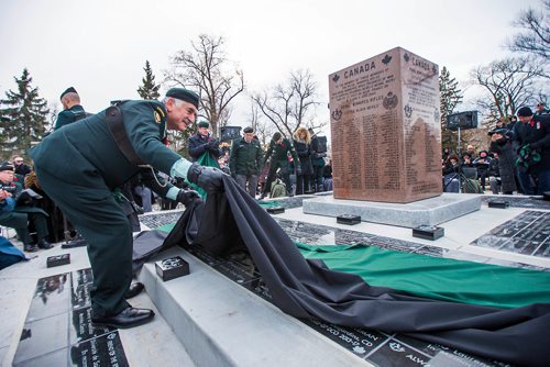 MIKAELA MACKENZIE / WINNIPEG FREE PRESS
Honorary Lieutenant-Colonel Albert El Tassi unveils the Legacy Stone Project at the135th anniversary commemoration service of the Royal Winnipeg Rifles at Vimy Ridge Memorial Park  in Winnipeg on Saturday, Nov. 10, 2018. 
Winnipeg Free Press 2018.