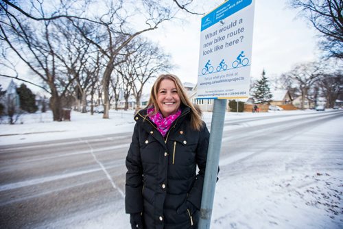 MIKAELA MACKENZIE / WINNIPEG FREE PRESS
Cindy Gilroy, city councillor, poses for a portrait by the sign asking for input into a bike lane on Wolseley Avenue in Winnipeg on Monday, Nov. 12, 2018. 
Winnipeg Free Press 2018.