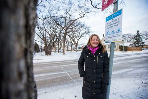 MIKAELA MACKENZIE / WINNIPEG FREE PRESS
Cindy Gilroy, city councillor, poses for a portrait by the sign asking for input into a bike lane on Wolseley Avenue in Winnipeg on Monday, Nov. 12, 2018. 
Winnipeg Free Press 2018.