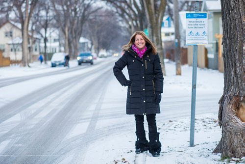 MIKAELA MACKENZIE / WINNIPEG FREE PRESS
Cindy Gilroy, city councillor, poses for a portrait by the sign asking for input into a bike lane on Wolseley Avenue in Winnipeg on Monday, Nov. 12, 2018. 
Winnipeg Free Press 2018.