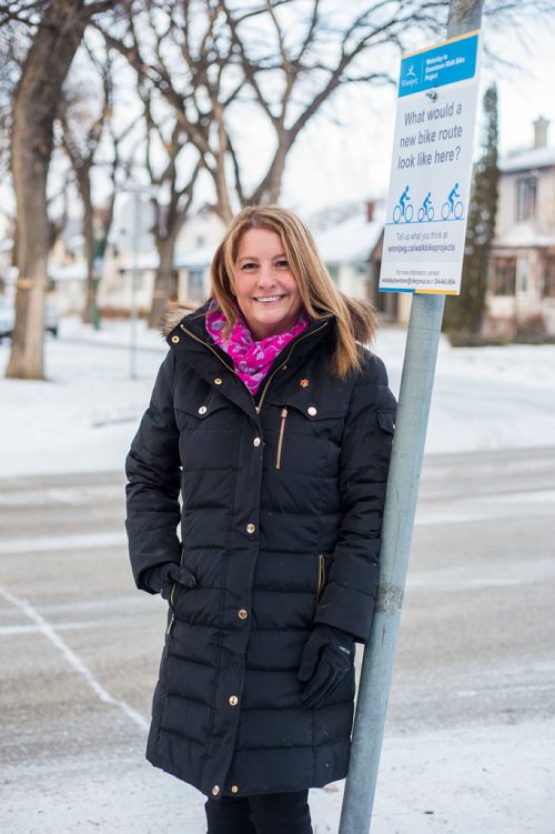 MIKAELA MACKENZIE / WINNIPEG FREE PRESS
Cindy Gilroy, city councillor, poses for a portrait by the sign asking for input into a bike lane on Wolseley Avenue in Winnipeg on Monday, Nov. 12, 2018. 
Winnipeg Free Press 2018.