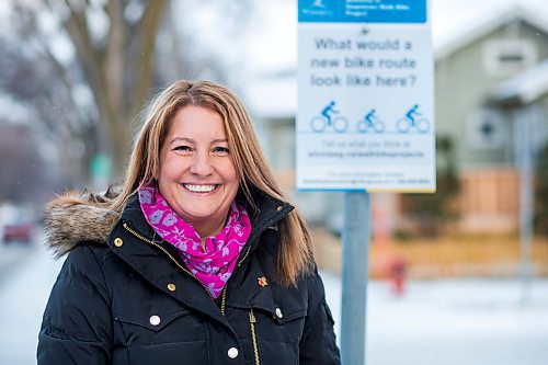 MIKAELA MACKENZIE / WINNIPEG FREE PRESS
Cindy Gilroy, city councillor, poses for a portrait by the sign asking for input into a bike lane on Wolseley Avenue in Winnipeg on Monday, Nov. 12, 2018. 
Winnipeg Free Press 2018.