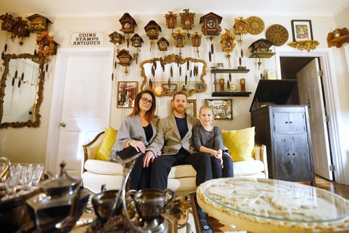 JOHN WOODS / WINNIPEG FREE PRESS
Murray Beilby is photographed with his partner Ainsley and daughter Livia, 9, amongst some of his clock collection Tuesday, November 12, 2018.