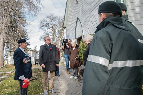 Canstar Community News St. James Anglican Church Rector Murray Still speaks to members of Winnipeg's Princess Patricia's Canadian Light Infantry Cadet Corps who visited the St. James Cemetary on Nov. 3 to place Canadian flags on the graves of more than 60 First World War soldiers. (EVA WASNEY/CANSTAR COMMUNITY NEWS/METRO)