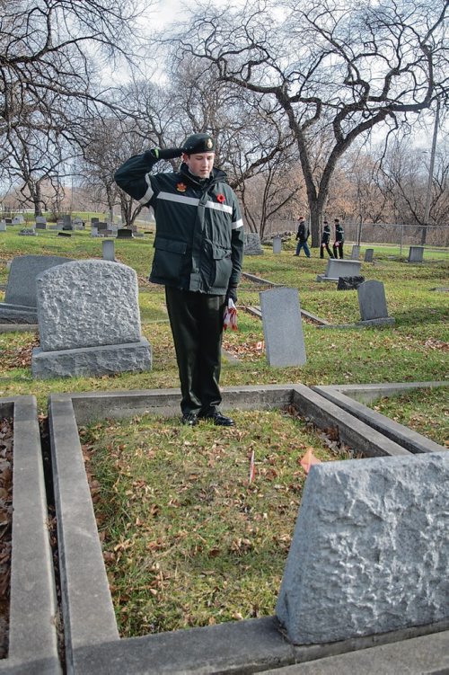 Canstar Community News Maguire Brophy salutes a soldier's grave. Members of Winnipeg's Princess Patricia's Canadian Light Infantry Cadet Corps visited the St. James Cemetary on Nov. 3 to place Canadian flags on the graves of more than 60 First World War soldiers. (EVA WASNEY/CANSTAR COMMUNITY NEWS/METRO)