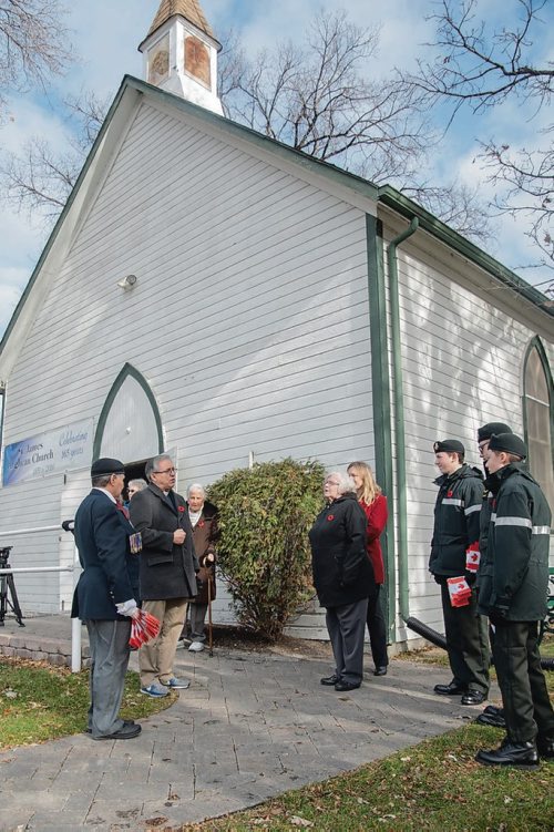 Canstar Community News St. James Anglican Church Rector Murray Still speaks to members of Winnipeg's Princess Patricia's Canadian Light Infantry Cadet Corps who visited the St. James Cemetary on Nov. 3 to place Canadian flags on the graves of more than 60 First World War soldiers. (EVA WASNEY/CANSTAR COMMUNITY NEWS/METRO)