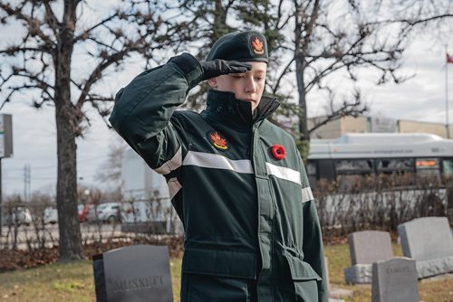 Canstar Community News Tristen Vincent places a flag on a soldier's grave. Members of Winnipeg's Princess Patricia's Canadian Light Infantry Cadet Corps visited the St. James Cemetary on Nov. 3 to place Canadian flags on the graves of more than 60 First World War soldiers. (EVA WASNEY/CANSTAR COMMUNITY NEWS/METRO)