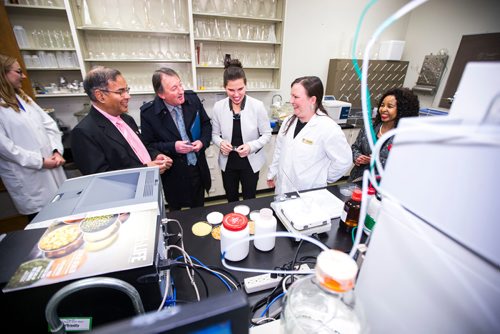 MIKAELA MACKENZIE / WINNIPEG FREE PRESS
Digvir Jayas (left), Ted Hewitt, and Kirsty Duncan get some of the research happening in Trust Beta's grains lab explained to them by Pollyanna Hornung (right) after announcing national investments in the Canada Research Chairs Program at the University of Manitoba in Winnipeg on Wednesday, Nov. 14, 2018. 
Winnipeg Free Press 2018.