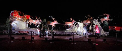 PHIL HOSSACK / WINNIPEG FREE PRESS - Santa's Helpers unwrap the new ride for Chris Cringle Thursday evening at the Forks. See story. - November 15, 2018