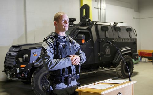 MIKE DEAL / WINNIPEG FREE PRESS
Winnipeg police tactical support team member Const. Tyler Loewen discusses the role of the WPS armoured vehicle and the toll the incident took on officers at the scene in the recent shooting standoff on Bannerman while standing in front of a bullet damaged police cruiser and the ARV1 inside police headquarters. 
181116 - Friday, November 16, 2018.
