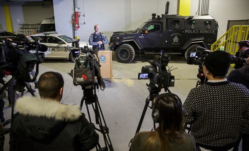 MIKE DEAL / WINNIPEG FREE PRESS
Winnipeg police tactical support team member Const. Tyler Loewen discusses the role of the WPS armoured vehicle and the toll the incident took on officers at the scene in the recent shooting standoff on Bannerman while standing in front of a bullet damaged police cruiser and the ARV1 inside police headquarters. 
181116 - Friday, November 16, 2018.