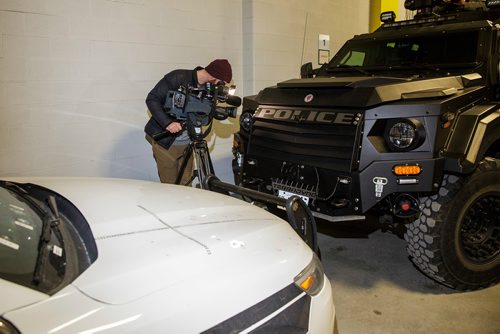 MIKE DEAL / WINNIPEG FREE PRESS
A bullet damaged police cruiser and ARV1 were the backdrop to a police media briefing inside police headquarters Friday afternoon. 
181116 - Friday, November 16, 2018.